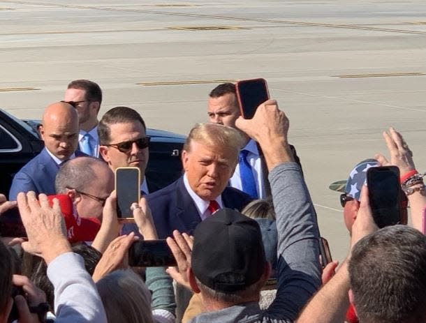 Former President Donald Trump arrived at Greenville-Spartanburg International Airport Tuesday afternoon. He took a little time to greet his supporters who waited a couple of hours for his plane, Trump Force One, to land.