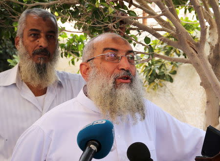 Salafist cleric leader Yasser Borhamy (R) talks to the media as he leaves a polling centre after casting his vote in Alexandria, Egypt, October 18, 2015. Picture taken October 18, 2015. REUTERS/Asmaa Waguih