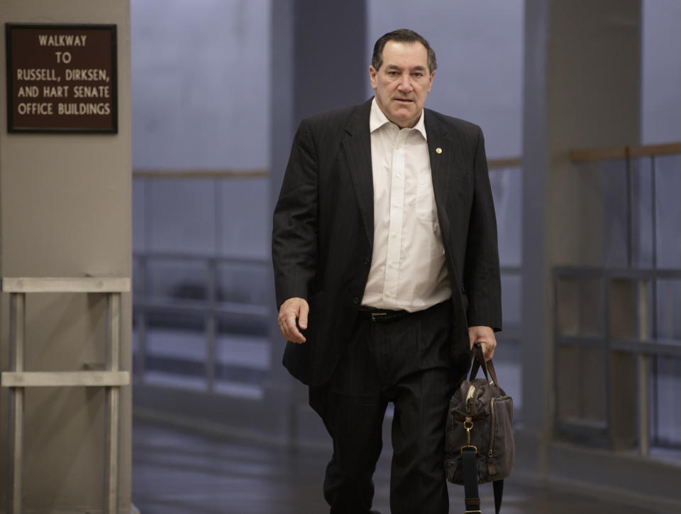 FILE - In this Friday, Feb. 3, 2017, file photo, Sen. Joe Donnelly, D-Ind., arrives early on Capitol Hill in Washington. Donnelly says he'll support the nomination of Judge Neil Gorsuch to the U.S. Supreme Court. The Indiana Democrat announced his support on Sunday, April 2, 2017, for President Donald Trump’s pick, calling Gorsuch "a qualified jurist who will base his decisions on his understanding of the law and is well-respected among his peers." Donnelly faces a tough re-election in 2018. (AP Photo/J. Scott Applewhite, File)