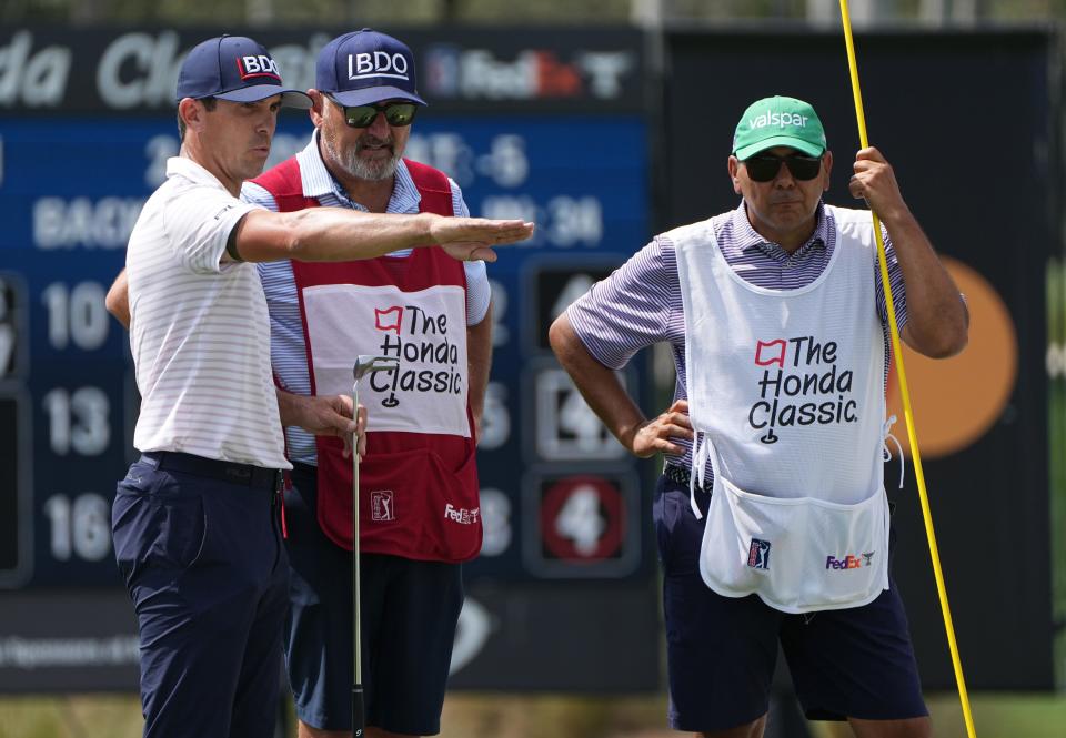 Billy Horschel, left, looks over the ninth hole during the first round of the Honda Classic at PGA National on Thursday, February 23, 2023 in Palm Beach Gardens.