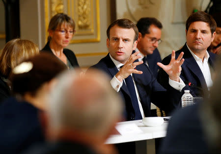 French President Emmanuel Macron gestures as he speaks during a debate with intellectuals at the Elysee Palace in Paris, France March 18, 2019. Michel Euler/Pool via Reuters