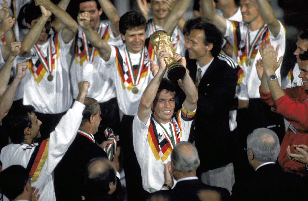 Germany captain Lothar Matthaeus holds the championship trophy after a 1-0 win over Argentina in the World Cup final in Rome.