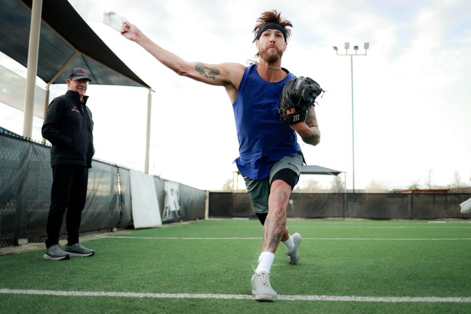 Tom House coaches pitcher Shane Greene.