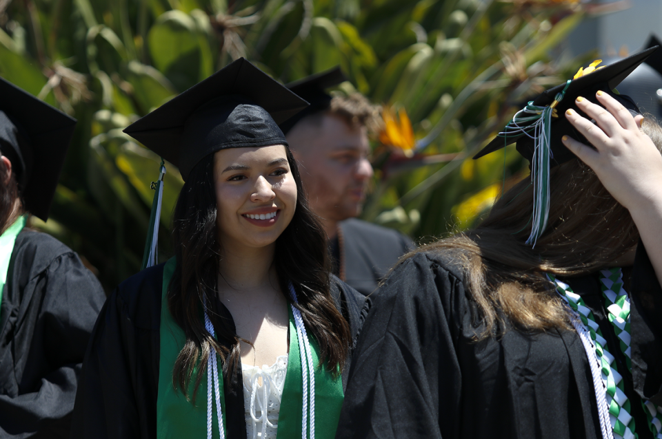 Jessica Lopez waits in the lineup before going on stage to receive her diploma at Cuesta College’s commencement on Friday, May 19, 2023. A total of 1,207 students graduated from the community college.