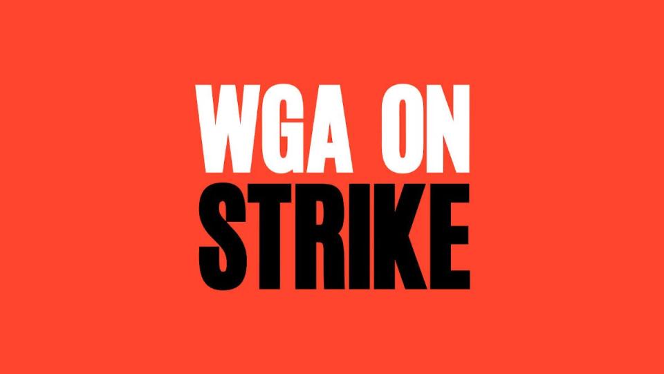 White and black text on a red background reading "WGA on strike"