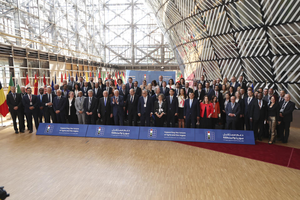 Participants pose for a group photo during the meeting 'Supporting the future of Syria and the region' at the European Council building in Brussels, Thursday, June 15, 2023. Aid agencies will struggle to draw the world's attention back to Syria at an annual donor conference hosted by the European Union in Brussels for humanitarian aid to Syrians. (AP Photo/Geert Vanden Wijngaert)