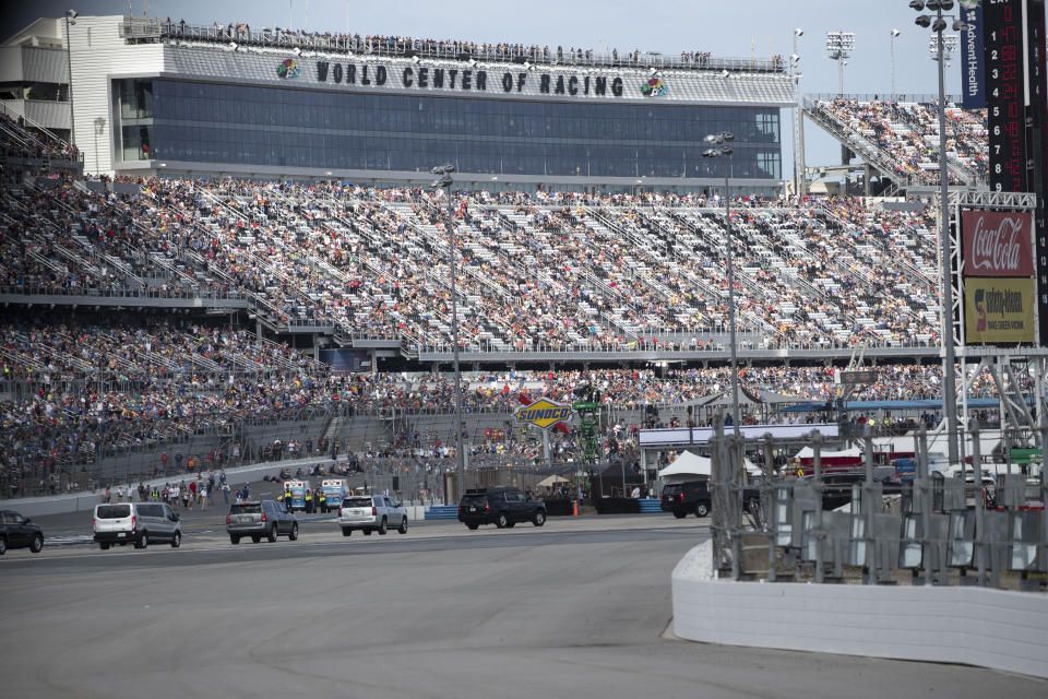 The motorcade for President Donald Trump arrives before the start of the NASCAR Daytona 500 auto race at Daytona International Speedway, Sunday, Feb. 16, 2020, in Daytona Beach, Fla. (AP Photo/Alex Brandon)