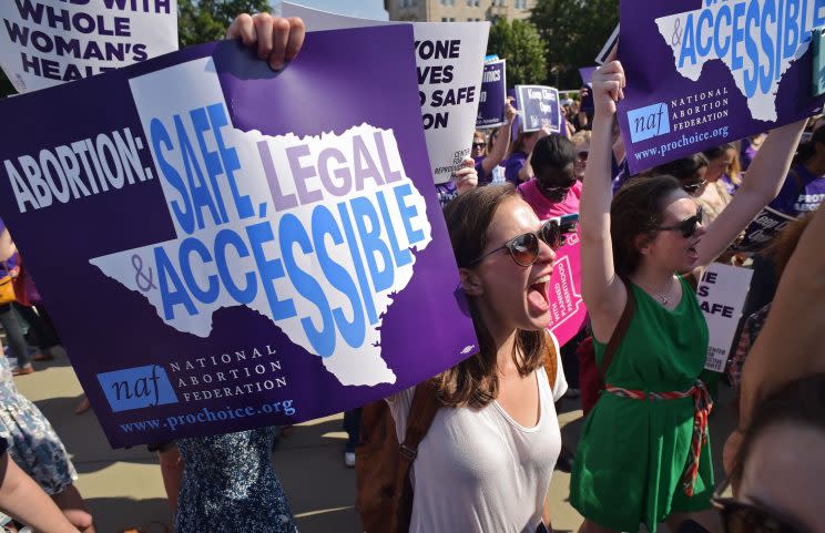 Abortion rights activists hold placards and chant outside of the US Supreme Court ahead of a ruling on abortion clinic restrictions on June 27, 2016 in Washington, DC. (Photo: Mandel Ngan/AFP/Getty Images)