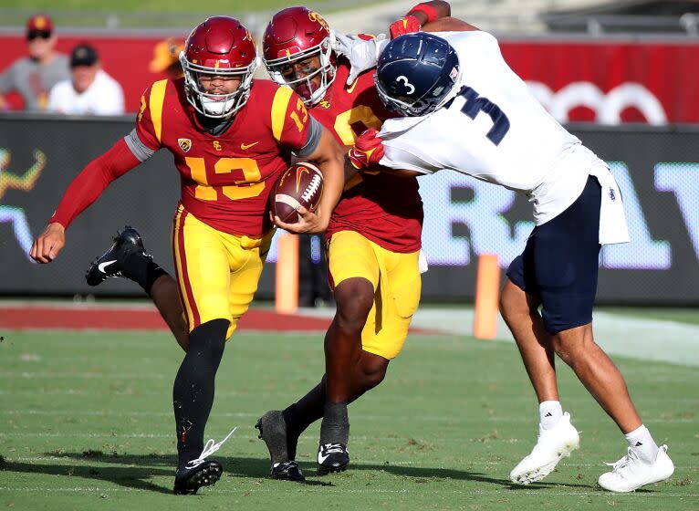 LOS ANGELES, CALIF. - SEP. 3, 2022. USC quarterback Caleb Williams scrambles for a gain against Rice.