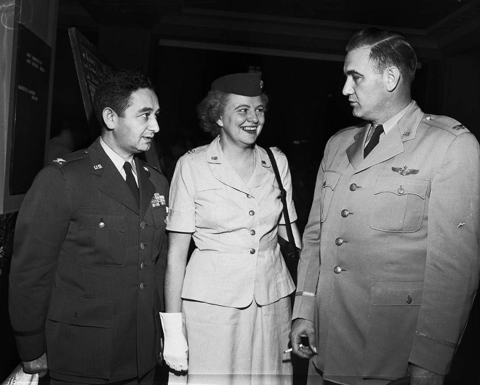 1950: Colonel W. Urbach, Selfridge Air Force Base, Detroit, left, listens in as Major Marjorie Hunt, Mitchel Air Force base, N. Y., chats with Colonel Roland Barnick, deputy for personnel, Continental Air Command, Mitchel Field.