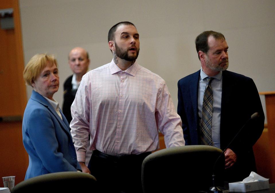 Adam Montgomery and his lawyers Caroline Smith and James Brooks watch as potential jurors enter the courtroom for jury selection ahead of his murder trial at Hillsborough County Superior Court in Manchester, New Hampshire, on Tuesday 6 February 2024 (AP)