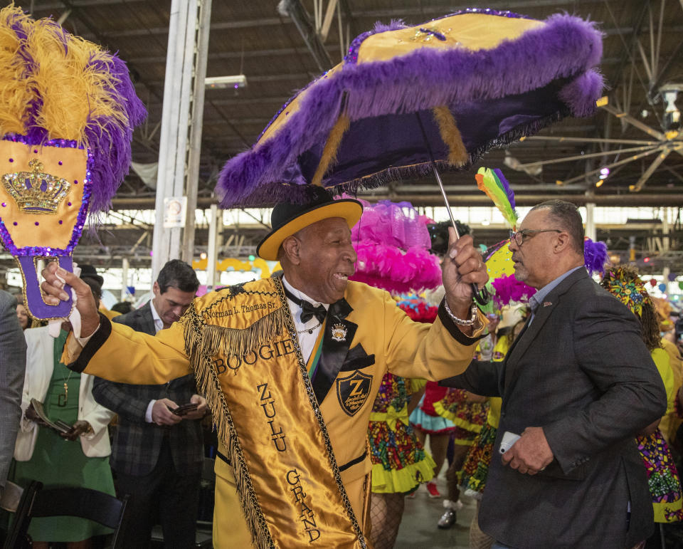 Zulu grand marshal Norman Thomas and city council member Oliver Thomas make their entrance during the King's Day celebration while kicking-off the official start of 2023 Carnival Season in New Orleans, Friday, Jan. 6, 2023. (David Grunfeld/The Times-Picayune/The New Orleans Advocate via AP)