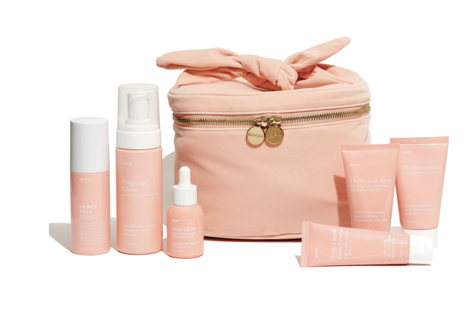 GO-TO's The At-Home Facial shown on a white background, including a pink zip bag with bow and several tubes and jars of skincare products.