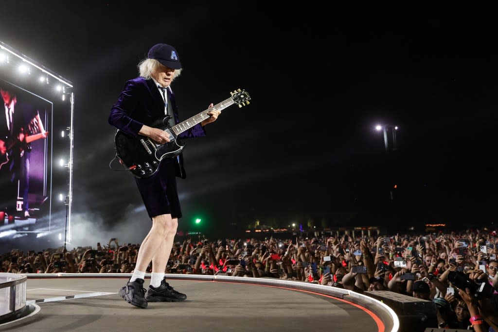 INDIO, CALIFORNIA - OCTOBER 07: (EDITORIAL USE ONLY) Angus Young of AC/DC performs onstage during the Power Trip music festival at Empire Polo Club on October 07, 2023 in Indio, California. (Photo by Kevin Mazur/Getty Images for Power Trip)