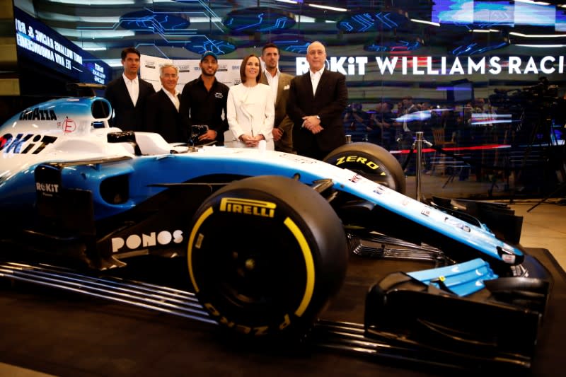 Israeli racing driver Roy Nissany, Williams deputy team principal Claire Williams, Sylvan Adams and Chemi Peres pose for a photo after Nissany signed with British Formula One motor racing team Williams in Tel Aviv