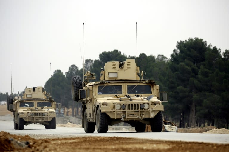 Manbij Military Council forces, part of the US-backed Syrian Democratic Forces (SDF), drive a humvee as they patrol the surrounding roads of in the northern Syrian town of Manbij on March 3, 2017