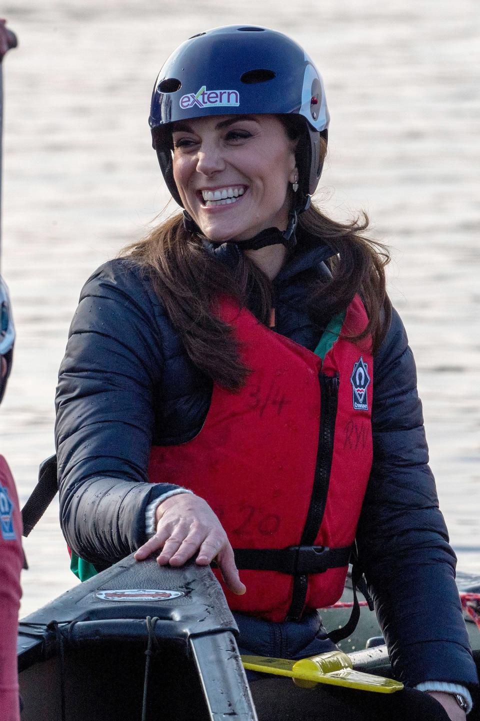 The royal mom covered up her puffer jacket with a helmet and life jacket while competing in a boat race in Northern Ireland in Feb. 2019.