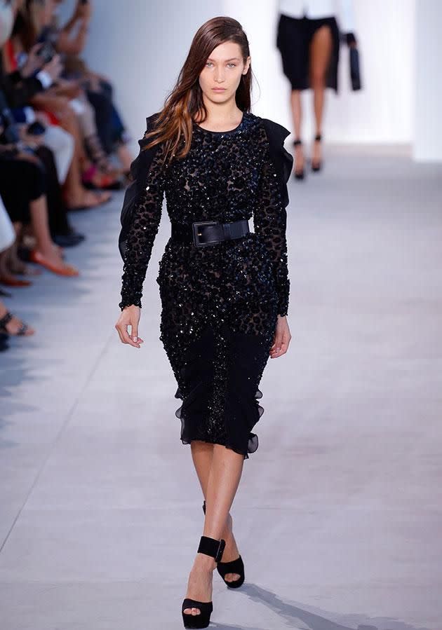 Bella Hadid walking on the Michael Kors runway/