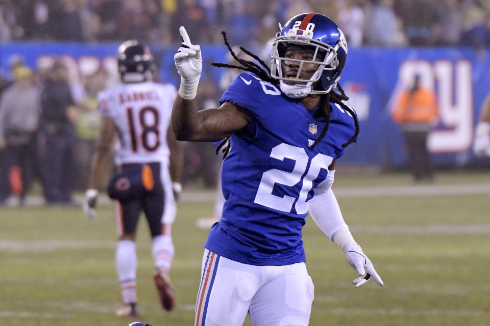 New York Giants cornerback Janoris Jenkins gestures after breaking up a pass intended for Chicago Bears wide receiver Taylor Gabriel, back, on the final play of overtime of an NFL football game, Sunday, Dec. 2, 2018, in East Rutherford, N.J. The Giants won 30-27 in overtime. (AP Photo/Bill Kostroun)