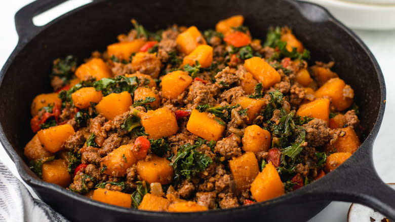 Beef and butternut squash in skillet