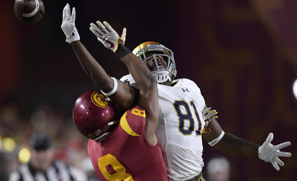 Notre Dame wide receiver Miles Boykin, right, can't reach a pass intended for him while under pressure from Southern California cornerback Iman Marshall during the first half of an NCAA college football game Saturday, Nov. 24, 2018, in Los Angeles. (AP Photo/Mark J. Terrill)