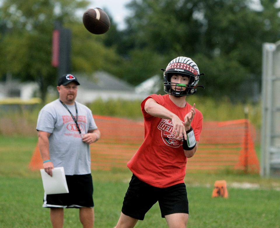 Nokomis High School's Kadynn Petty passes the ball during a drill at football practice Tuesday, Sept. 24, 2024.