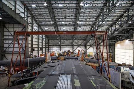 The Vulcan Aerospace's Stratolaunch rockets wing assembly is shown under construction by Northrop Grumann Scaled Composites at the Mojave Air and Space Port in Mojave, California, U.S. in this handout photo released to Reuters June 19, 2016. Vulcan Industries/Handout via Reuters