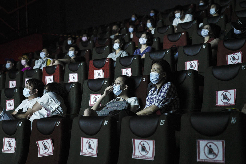 WUHAN, CHINA - JULY 20: (CHINA OUT)Residents watch a movie in a cinema in Wuhan on July 20, 2020 in Wuhan ,Hubei Province,China.Taking various measures against COVID-19, cinemas in the city reopened in an orderly manner on Monday. The China Film Administration, in a circular last week, allowed cinemas in low-risk areas to resume operation with effective epidemic prevention measures in place. (Photo by Getty Images)