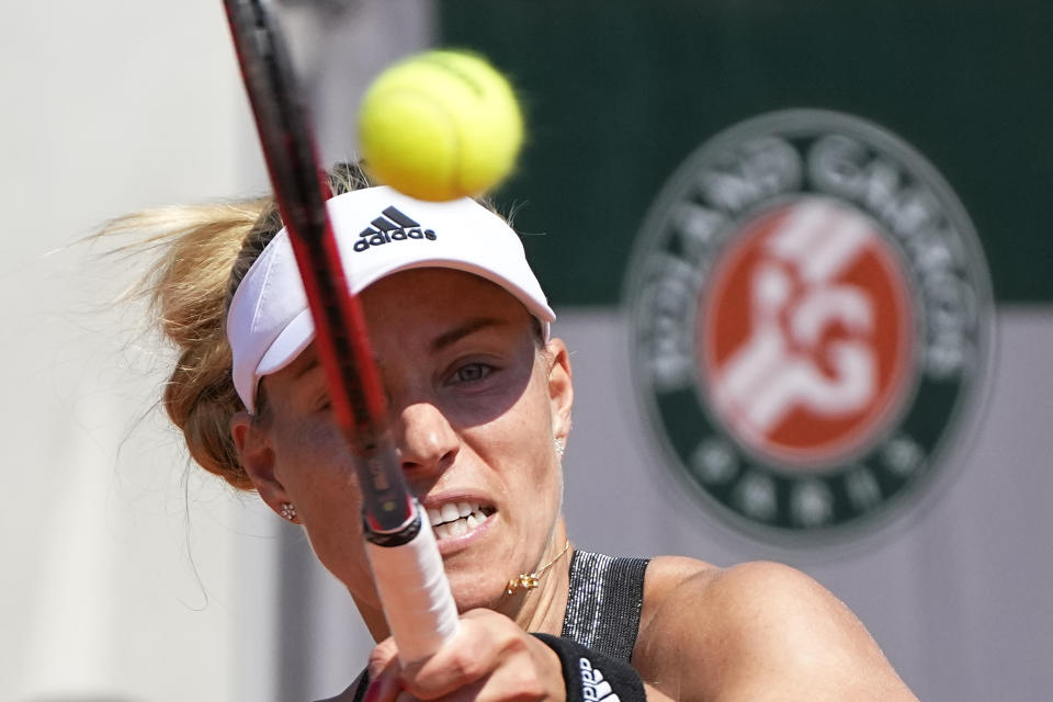 Germany's Angelique Kerber returns the ball to Ukraine's Anhelina Kalinina during their first round match of the French Open tennis tournament at the Roland Garros stadium Sunday, May 30, 2021 in Paris. (AP Photo/Michel Euler)