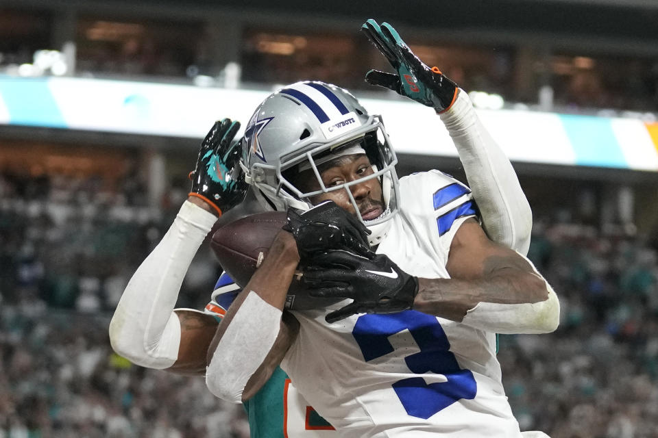 Dallas Cowboys wide receiver Brandin Cooks (3) catches a pass for a touchdown during the second half of an NFL football game against the Miami Dolphins, Sunday, Dec. 24, 2023, in Miami Gardens, Fla. (AP Photo/Rebecca Blackwell)