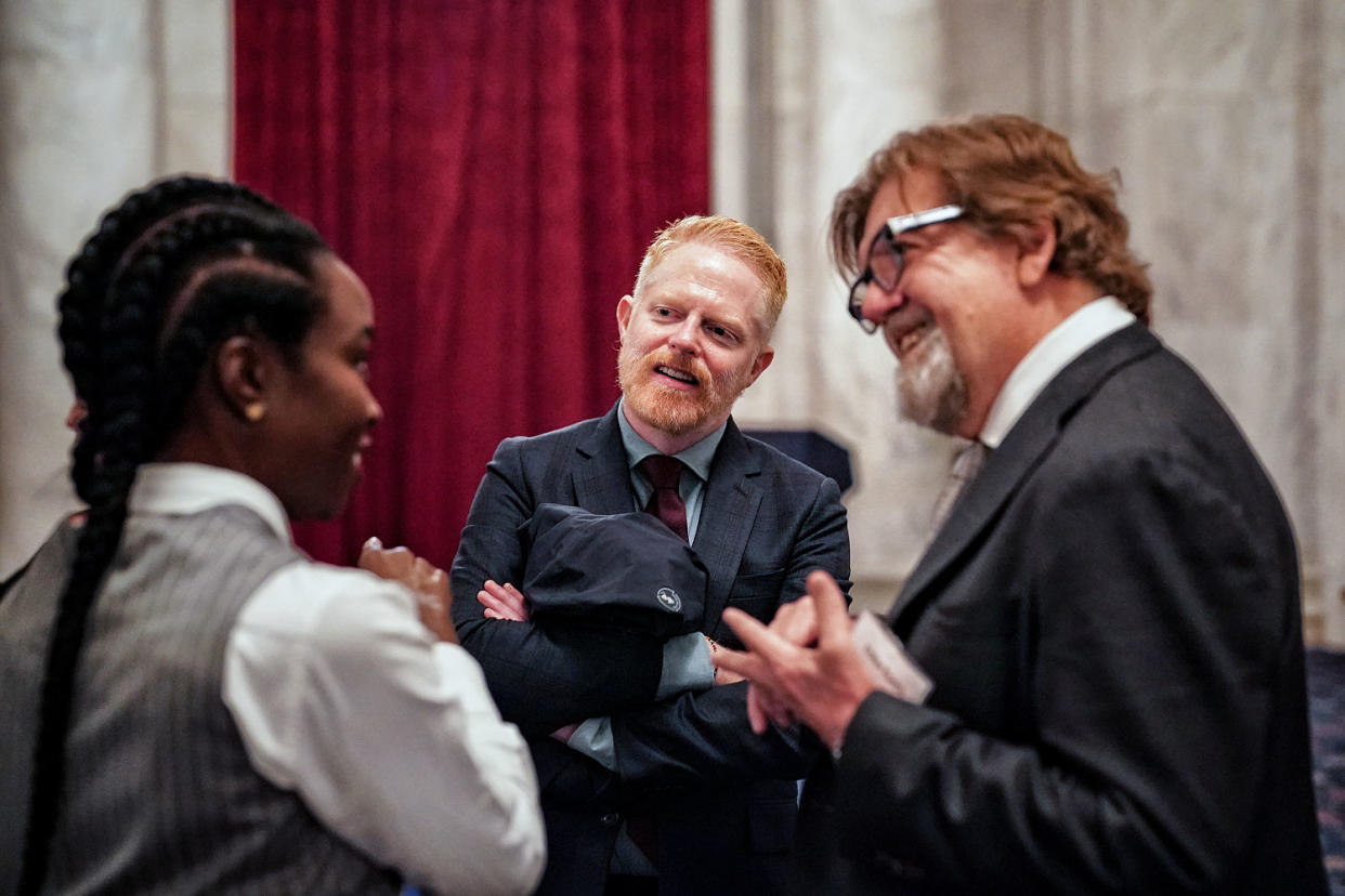 Actors Jesse Tyler Ferguson and Danai Gurira talk to the New York Public Theater’s artistic director, Oskar Eustis, while advocating for legislation to fund theaters on April 11. (Frank Thorp V / NBC News)