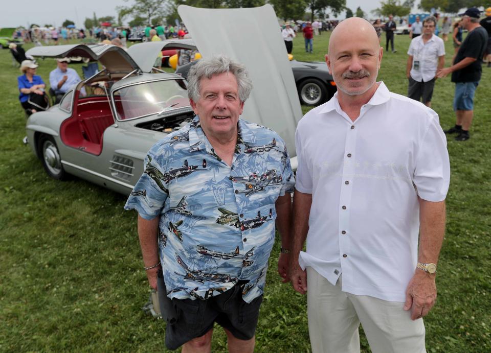 Skip Mueller, left, and Joseph L. Ford III  have sued to take possession of a very rare $7 million 1938 French sports car that was stolen from Mueller's cousin in Milwaukee in 2001 and is now in the possession of a wealthy collector who bought it through European brokers. The Wisconsin Supreme Court may decide who gets it. They’re pictured at the 2018 Milwaukee Concours d'Elegance at Veterans Park on Sunday, August 5, 2018.