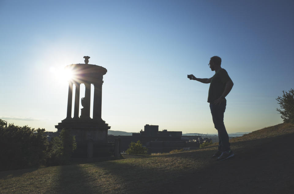 Person taking a photo at Calton Hill, Edinburgh 