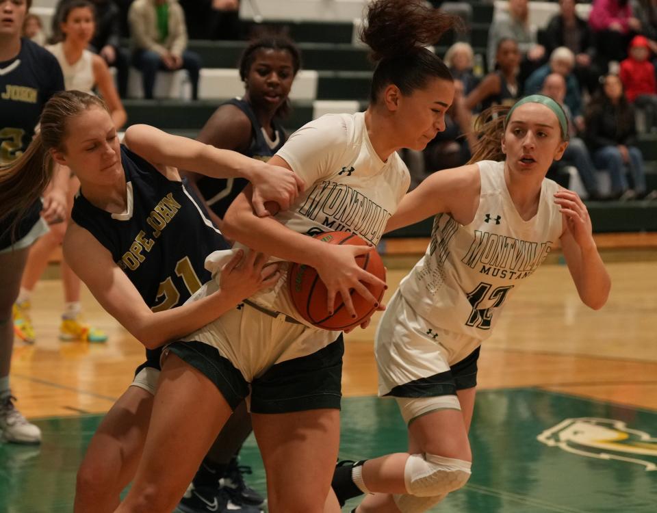 Addison Platt of Pope John tries to get the rebound from Carey Werheim of Montville in the first half as Montville topped Pope John 64-39 in NJAC-American girls basketball played in Montville, NJ on January 12, 2023.