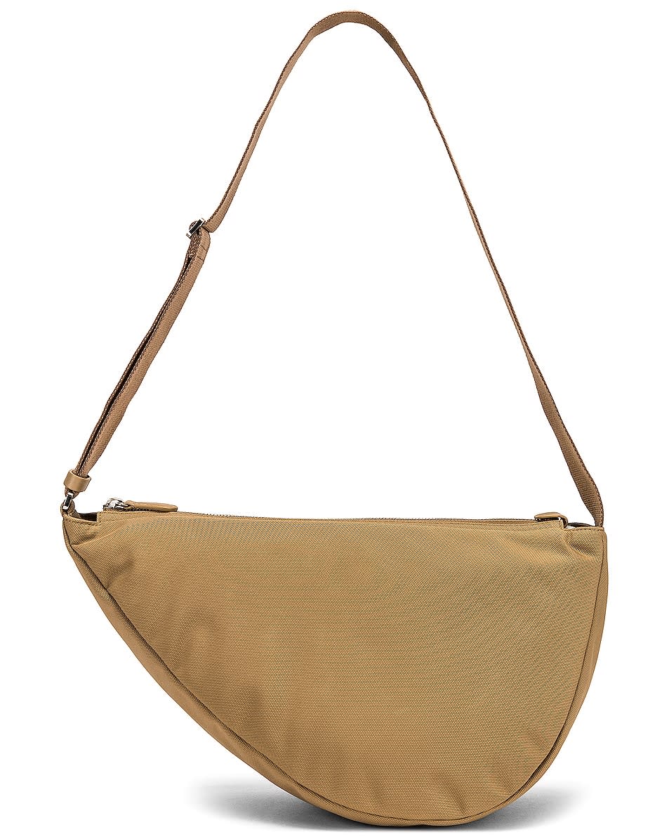 <p><a href="https://go.redirectingat.com?id=74968X1596630&url=https%3A%2F%2Fwww.fwrd.com%2Fproduct-the-row-slouchy-banana-two-bag-in-dune-pld%2FTERX-WY140%2F&sref=https%3A%2F%2Fwww.cosmopolitan.com%2Fstyle-beauty%2Ffashion%2Fg46047805%2Fbest-designer-crossbody-bags%2F" rel="nofollow noopener" target="_blank" data-ylk="slk:Shop Now;elm:context_link;itc:0;sec:content-canvas" class="link ">Shop Now</a></p><p>Slouchy Banana Two Bag</p><p>fwrd.com</p><p>$1350.00</p>