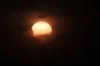 A partially-eclipsed sun is seen in Amman November 3, 2013. Skywatchers across the world are in for a treat Sunday as the final solar eclipse of 2013 takes on a rare hybrid form. REUTERS/Muhammad Hamed (JORDAN - Tags: SOCIETY ENVIRONMENT)