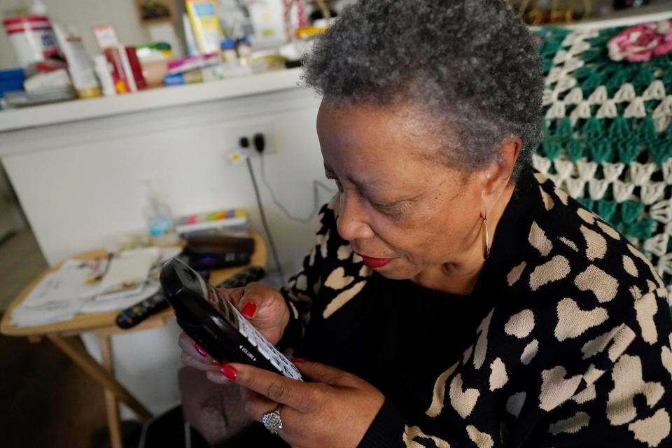 Lee Cole, 74, who is blind, uses a cordless telephone with enlarged numbers so she can make phone calls, Friday, March 24, 2023, at her Jackson, Miss., apartment. Disjointed coordination between election authorities and disability advocates has been a persistent problem in Mississippi, especially related to reliable transportation. It was the reason Cole, missed a local election in Jackson in January. That frustrated Cole, because she said she tries to vote in every election.