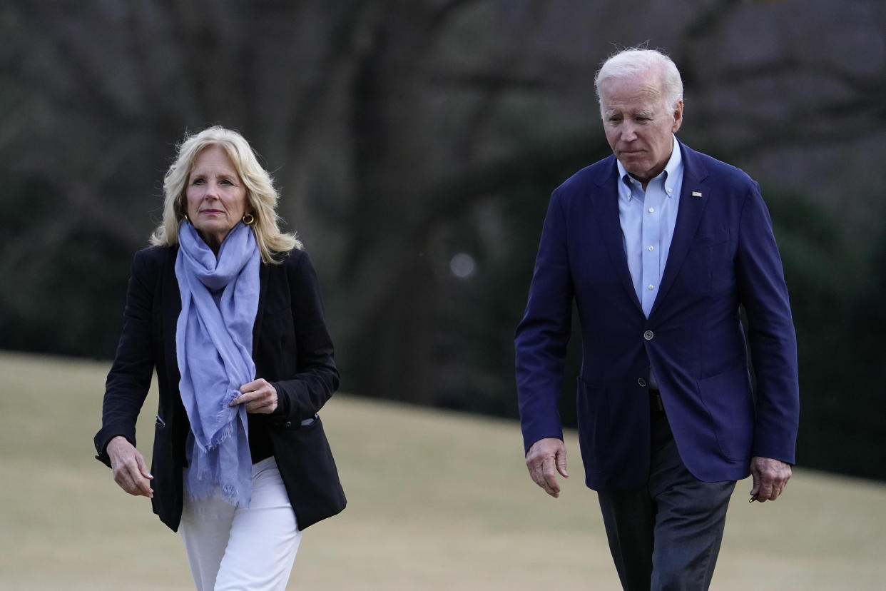 FILE - President Joe Biden and first lady Jill Biden walk on the South Lawn of the White House after stepping off Marine One, Monday, Jan. 2, 2023, in Washington. Jill Biden will undergo a medical procedure next week to remove a small lesion from above her right eye that was discovered during a routine skin cancer screening, the White House announced Wednesday. (AP Photo/Patrick Semansky, File)