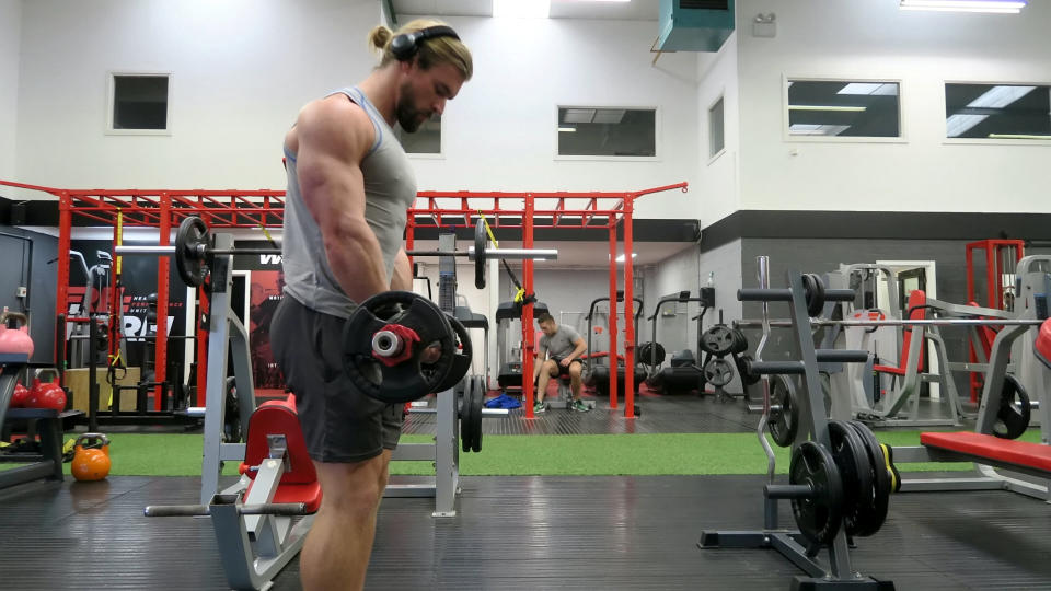 Ben Mudge training. See SWNS story SWTHOR; Super-fit comicbook fan has defied his degenerative lung condition to transform himself into a real-life Thor. A gym fanatic has hit back at his degenerative lung condition and defied doctors expectations by transforming himself into a real-life THOR. Personal trainer Ben Mudge, 27, was born with cystic fibrosis and was spurred into getting fit when his lung function plummeted as a teenager. Doctors told him he'd never fully recover - so he hit the weights to prove them wrong, honed a super-buff physique and improved his health dramatically. But the self-confessed superhero didn't stop there - and when friends at the gym told him he looked a bit like Thor, he grew his hair long in tribute to his favourite hero. Now he's a double of the Chris Hemsworth movie character and posts weekly 'Thorsday' photos online of him dressed as the superhero - complete with hammer. Ben, from Belfast, said: 