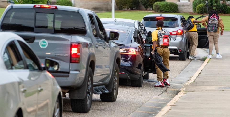 Students arrive Thursday for the first day of school at Mckee Middle School.