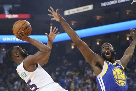 March 31, 2019; Oakland, CA, USA; Charlotte Hornets guard Kemba Walker (15) shoots the basketball against Golden State Warriors forward Draymond Green (23) during the first quarter at Oracle Arena. Mandatory Credit: Kyle Terada-USA TODAY Sports