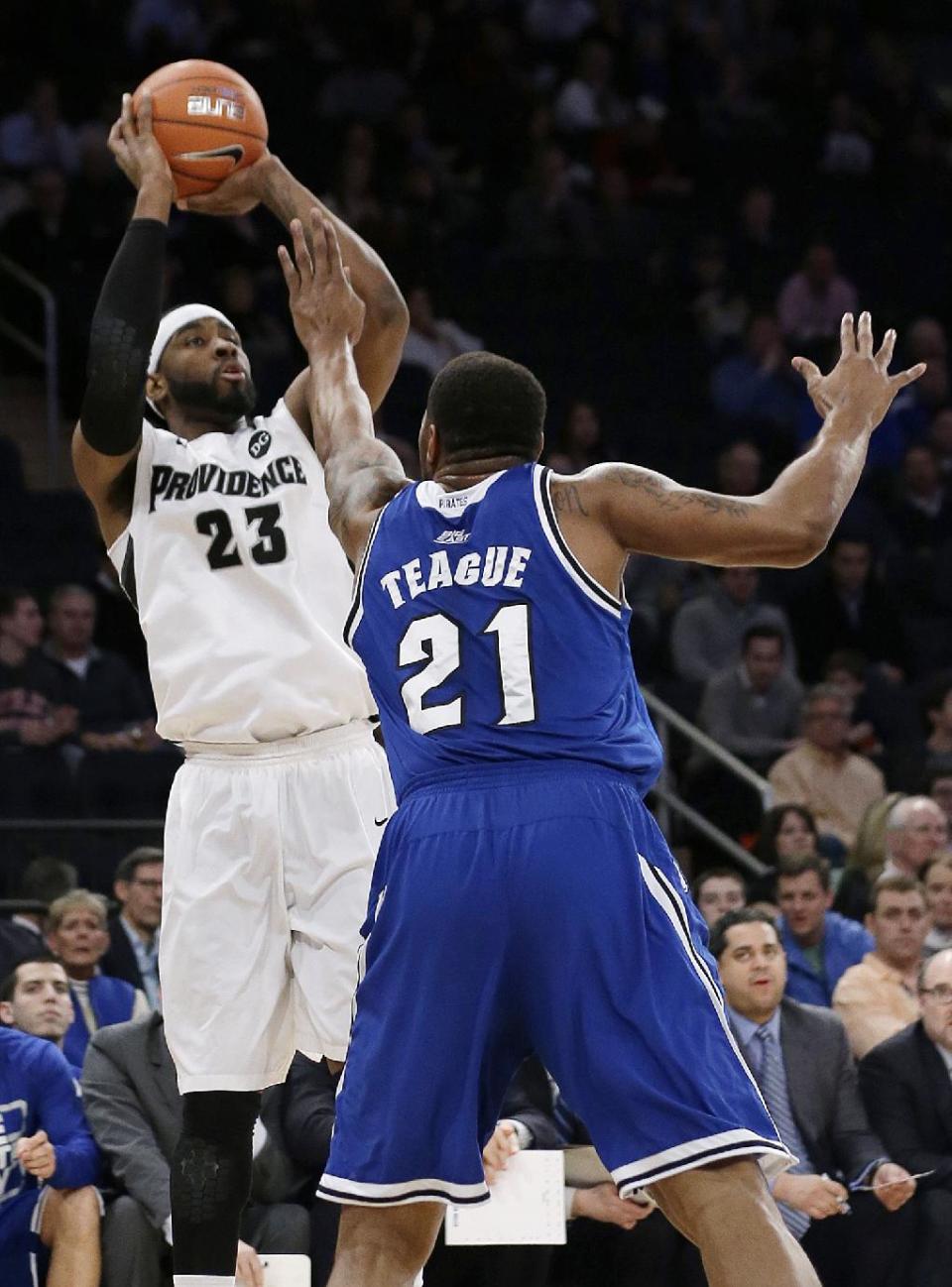 Providence's LaDontae Henton (23) shoots over Seton Hall's Eugene Teague (21) during the first half of an NCAA college basketball game in the semifinals of the Big East Conference men's tournament Friday, March 14, 2014, at Madison Square Garden in New York. (AP Photo/Frank Franklin II)