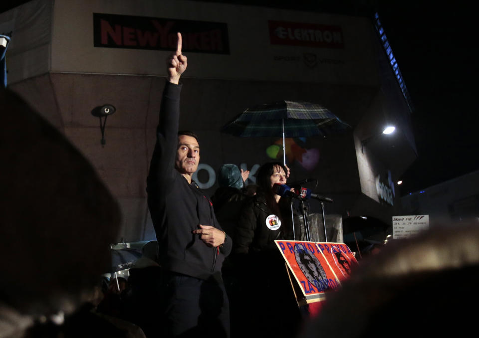 Davor Dragicevic, left, gestures to supporters during a protest in Banja Luka, Bosnia on Sunday, Dec. 30, 2018. Several thousand Bosnians have rallied in support of the man whose quest for the truth about his son’s death has turned into a wider movement for justice and rule of law in the Balkan country. The protest on Sunday demanded the ouster of Bosnian Serb Interior Minister Dragan Lukac and top police officials over the death in March of 21-year-old David Dragicevic. (AP Photo/Amel Emric)