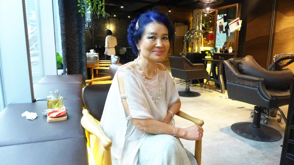 <p>Madame Leekaja, who is now in her 70s, flew to Singapore for the launch of her beauty chain. She is seen here dressed in a white dress and spotting blur hair. </p>