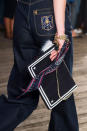 <p>There were oversize backpacks and totes too, but this clutch bag with trinkets and scarf caught our eye the most. <i>(Photo: Imax Tree)</i></p>