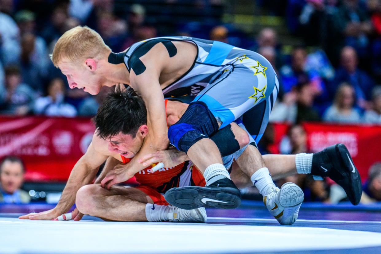 Dalton Roberts of Fowlerville (top) won the Greco-Roman 60-kilogram weight class at the wrestling U.S. Olympic Team Trials in State College, Pa.