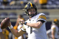 FILE - Iowa quarterback Spencer Petras warms up before the Citrus Bowl NCAA college football game against Kentucky, Jan. 1, 2022, in Orlando, Fla. Iowa’s offense struggled with consistency last season. The work in the offseason has been about improving that behind Petras and a young line. (AP Photo/Phelan M. Ebenhack, File)