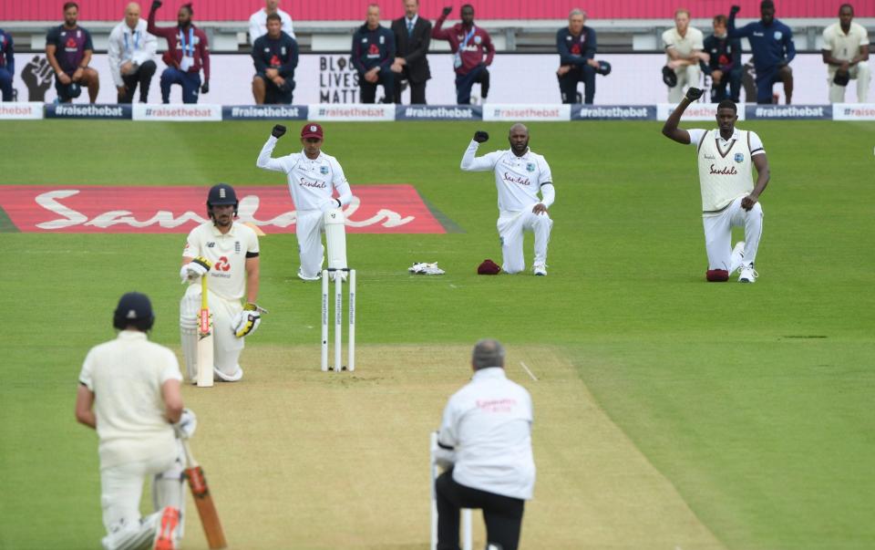 Rory Burns and Dom Sibley of England take a knee alongside Shane Dowrich, Jermaine Blackwood and Jason Holder of the West Indies during day one of the 1st #RaiseTheBat Test match at The Ageas Bowl on July 08, 2020 in Southampton, England. - GETTY IMAGES