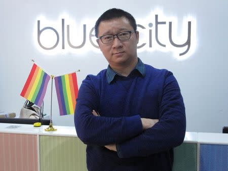 Ma Baoli, founder of Blue City, parent company of Chinese gay dating app Blued, poses for pictures at his office reception area in Beijing, January 7, 2015. REUTERS/Guo Yeqi