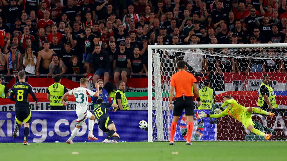 Csoboth scores for Hungary past Scotland goalkeeper Angus Gunn. - Lee Smith/Reuters